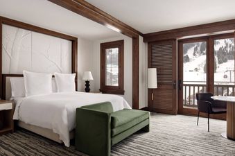 The Four Seasons Mountain Side Room offers a luxurious bedroom experience with a stunning mountain view.