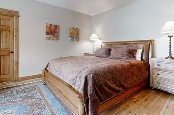 EagleRidge Townhomes 1516 features a bedroom with a unique wood-paneled ceiling.