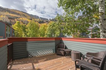 The cozy balcony at Telluride Lodge 308 offers a relaxing outdoor space with comfortable seating and scenic views.
