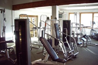 The fitness center with various exercise machines.
