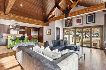 Spacious and modern living area in a luxurious home.