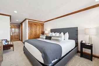 The bedroom in Lodge Tower 682 Lodge Room K features a comfortable king bed.