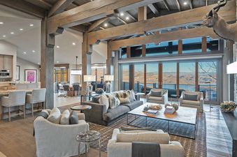 The Dreamscape 365 living room offers comfortable seating and stunning mountain views.