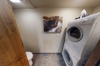 A white washer and dryer in a small laundry room.