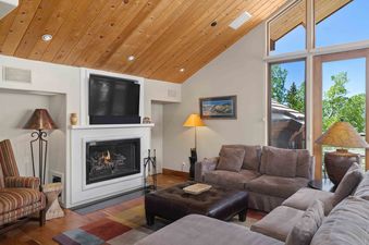 A cozy living area featuring a fireplace and comfortable seating.