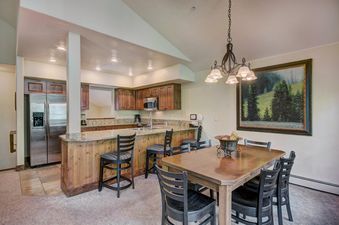 The dining area and kitchen of Mountain Thunder 2 Bedroom TH.