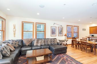 Living area at Pacific Street Townhome 522A with a comfortable sectional sofa and inviting decor.
