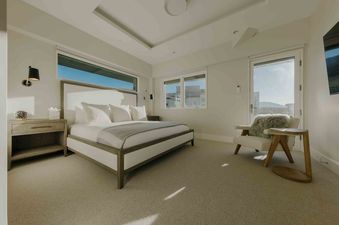 The master bedroom at Silver Cloud Retreat boasts natural light and modern comforts.