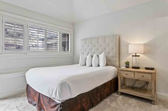 Daystar 1733 bedroom with plush bed and nightstand.