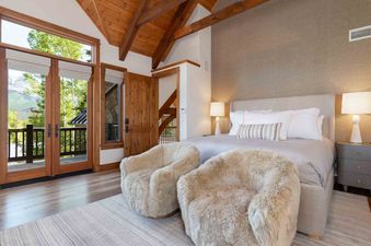 The beautiful bedroom in Snow Creek Cabin invites you to relax.