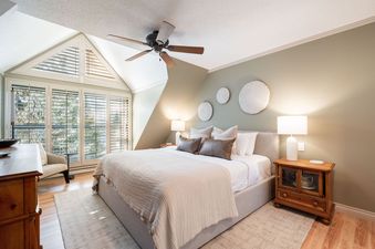 Main bedroom with king bed and vaulted ceiling in Foxglove 1