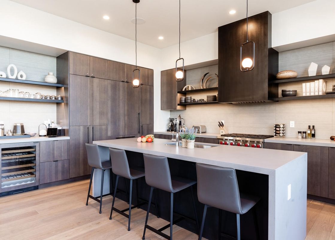 The kitchen of Moonlight Basin 6A Treeline Springs features modern appliances, a sleek design, and ample counter space.