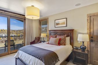 Bedroom with a king size bed and a view of a valley