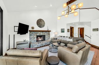 Inviting living room with fireplace and comfortable seating.