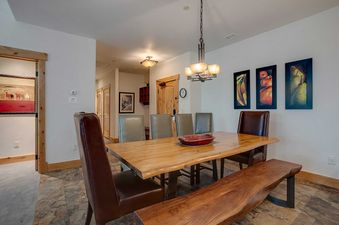 Dining area at Bear Lodge BL6304 with wooden table and chairs.