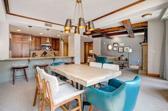 The dining and living area provide a spacious and comfortable place to relax at Abode at First Dawn B.