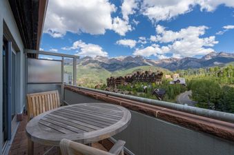 The Peaks Penthouse 843 balcony offers stunning mountain views.