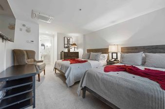 Lodge Tower 487 3 Bedroom offers a cozy bedroom with two beds and a relaxing atmosphere.