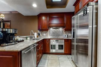 Westgate Iconic Condo 4814's kitchen features stainless steel appliances including a refrigerator, oven, dishwasher, and coffee maker.