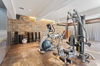 A modern and spacious private gym at Silverado with professional workout equipment.