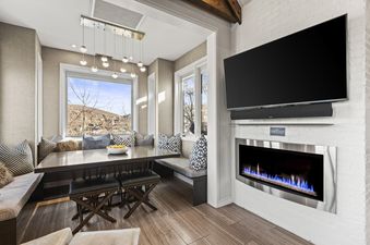 Dining nook and fireplace inside Abode at Powder Watch.