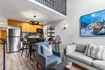 Cozy open concept living room and kitchen in Snowcrest 302.