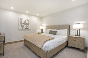 The primary bedroom at Vail Center Place 2 Bedroom Diamond Unit 2 features a comfortable bed with a plush comforter.