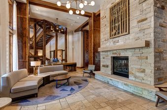 The inviting lobby of Abode at First Dawn A features comfortable seating and a cozy fireplace.