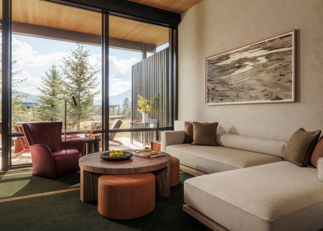 Living room with scenic views in the Two Bedroom Cabin at One&Only Moonlight Basin.