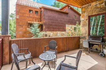 The patio area at Trails Edge 1 Mountain Village features comfortable seating and a grill.