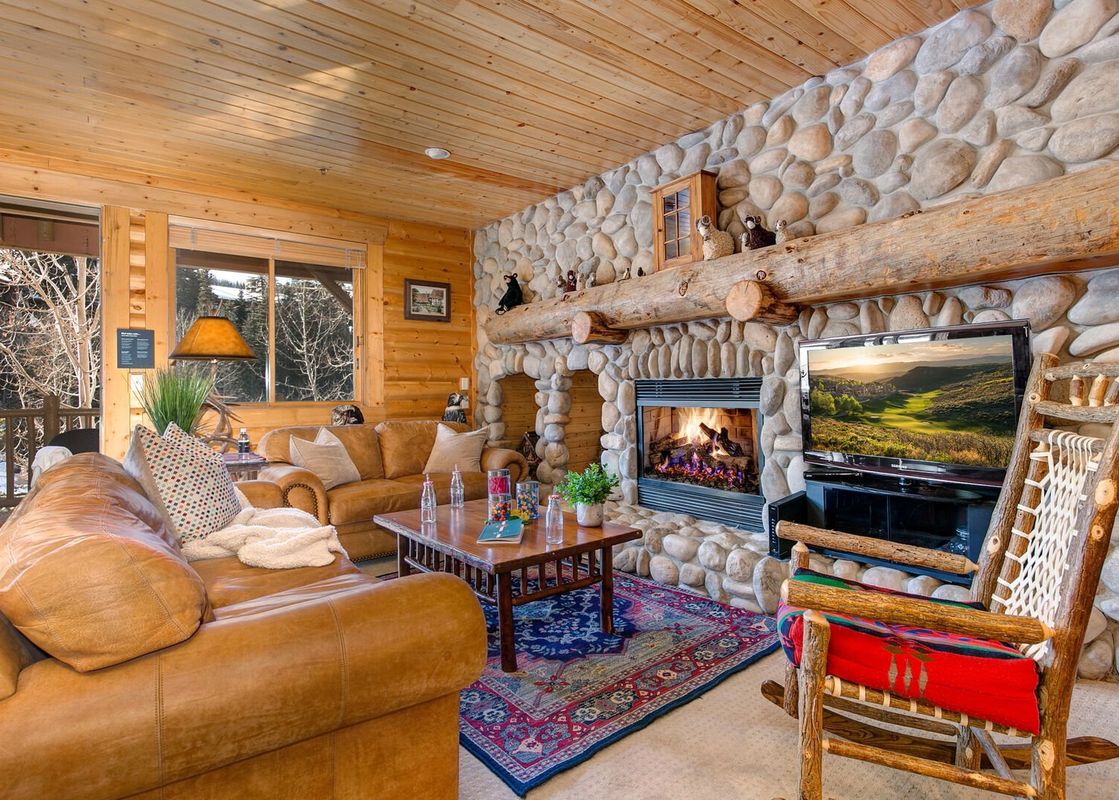 The comfortable living room in Black Bear 305 Abode is cozy and inviting.
