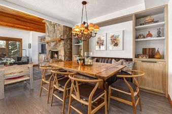 The dining area at Abode at the Ridge in Deer Valley offers a warm and inviting space for gatherings.