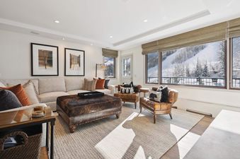 Lodge Tower 687 2 Bedroom living room with comfortable seating and a view of the slopes.