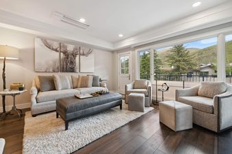Lodge Tower 278 2BR living room, featuring a plush sofa, a large rug, two chairs, a coffee table, and two end tables.