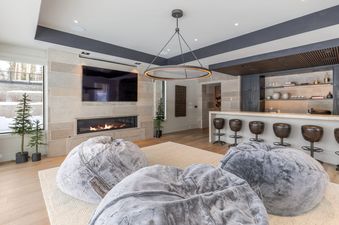 The Lone Star Lodge features a cozy lounge area with a fireplace and bar.