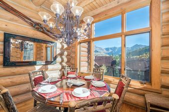 The dining area in Villas At Tristant 215 is warm and inviting with natural light.
