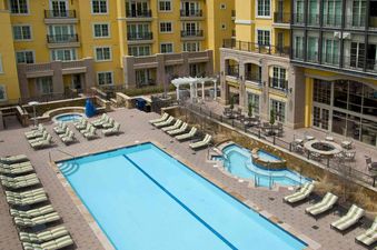 The Ritz Carlton Vail 402 unit offers a private outdoor pool, hot tub, and lounge area.