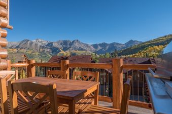 Outdoor dining on the deck at Villas At Tristant 215.