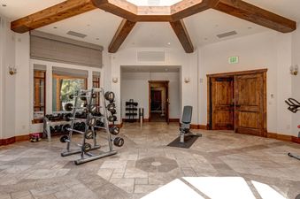 The gym at Abode at First Dawn A is well-equipped and ready for a workout.