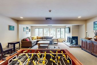 The Foosball table and fireplace in the games room at Fallridge 312.
