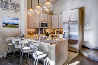 Kitchen with stainless steel appliances and granite countertops.