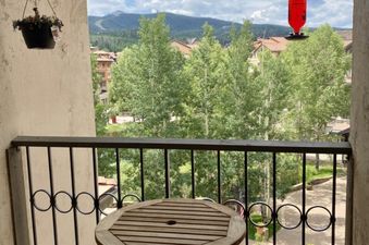 Balcony view from Westermere 411 featuring a table and chairs.