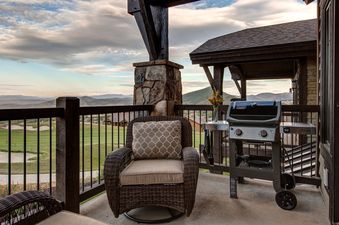Inviting outdoor patio at Abode at Fairway Springs with comfortable seating and a view of the golf course.