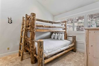 A rustic wooden bunk bed dominates the bedroom in Daystar 1733.
