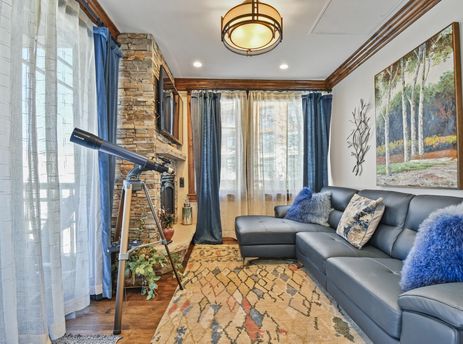 The living area of Silver Strike Lodge 201 features a sectional sofa, a fireplace, and a large area rug, creating a warm and inviting atmosphere.