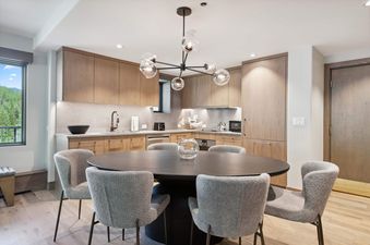 The dining area in Lodge Tower 699 features seating for six.