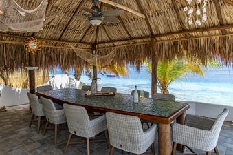 Bonaire-Sunset-Villa-dining-table-ocean-front