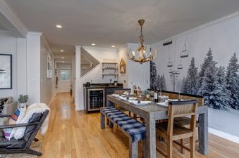 The dining area at Abode at Watson House is warmly lit and perfect for enjoying meals together.