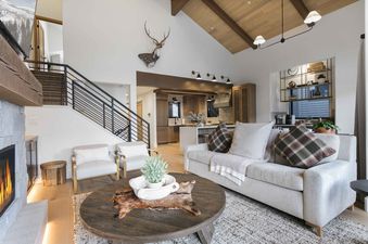 Living area in Boulder Creek 1072 with a fireplace and lots of seating.