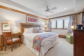 The Lodge Tower 686 2 Bedroom features a well-appointed bedroom with a plush bed and inviting decor.